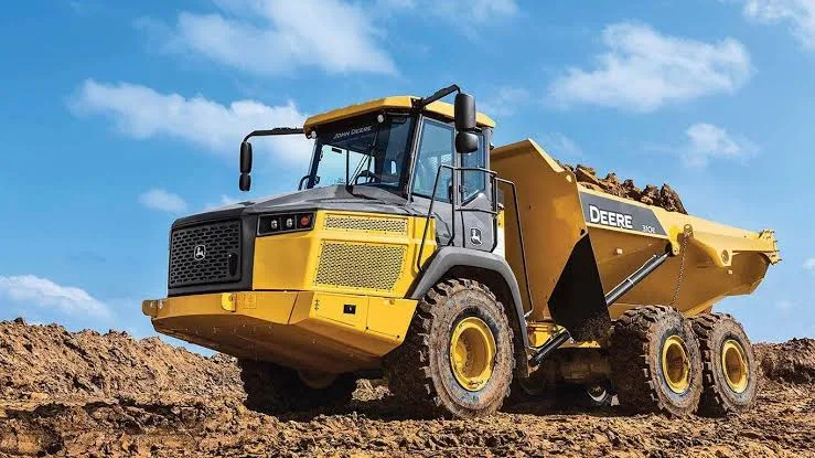 Heavy dump truck moving material at a gravel pit